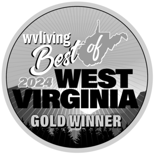 A circular badge featuring "Best of West Virginia 2024" with a gold winner designation, incorporating the outline of the state and a mountain backdrop.