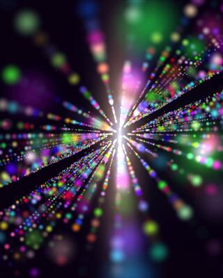 A vibrant burst of colors radiates from a central point, creating a dazzling display of lights against a dark background.