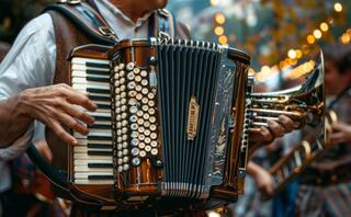 A musician plays an ornate accordion, surrounded by festive lights and a lively atmosphere, capturing the spirit of celebration.