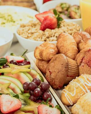 close up of muffins and fruit and other breakfast items